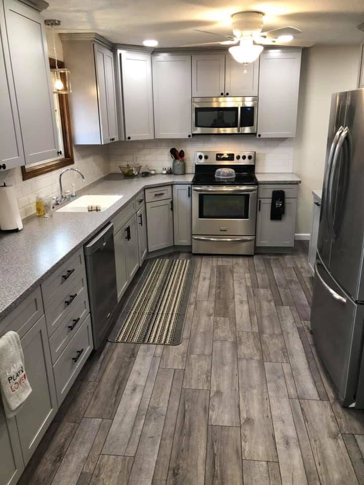 Custom kitchen remodel with grey cabinetry and luxury vinyl plank flooring by Stark Elite Home Solutions