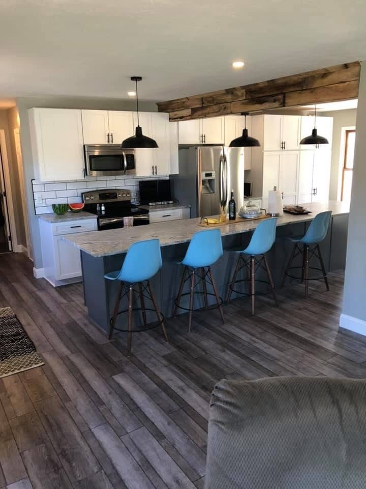 Finished garage conversion with hardwood flooring and custom kitchen in Stark County, Ohio